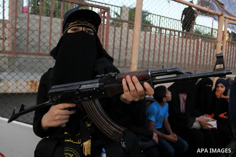 Palestinian female militants from the Al-Quds Brigades, the armed wing of the Islamic Jihad movement, take part in a rally in Rafah in the southern Gaza Strip on July 28, 2016. Photo by Abed Rahim Khatib
