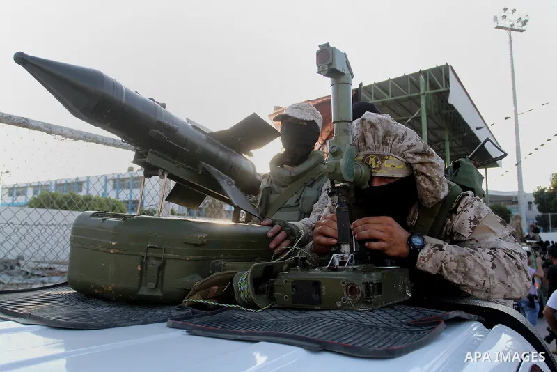 Palestinian militants from the Al-Quds Brigades, the armed wing of the Islamic Jihad movement, take part in a rally in Rafah in the southern Gaza Strip on July 28, 2016. Photo by Abed Rahim Khatib