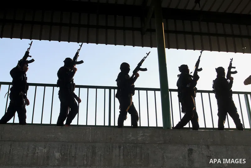 Palestinian militants from the Al-Quds Brigades, the armed wing of the Islamic Jihad movement, take part in a rally in Rafah in the southern Gaza Strip on July 28, 2016. Photo by Abed Rahim Khatib