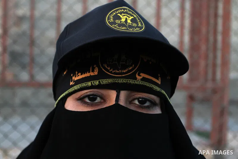 Palestinian female militants from the Al-Quds Brigades, the armed wing of the Islamic Jihad movement, take part in a rally in Rafah in the southern Gaza Strip on July 28, 2016. Photo by Abed Rahim Khatib