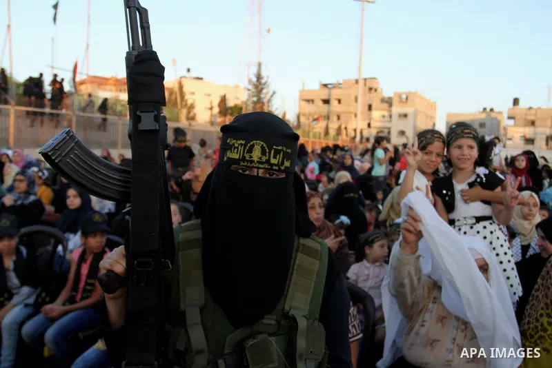 Palestinian female militants from the Al-Quds Brigades, the armed wing of the Islamic Jihad movement, take part in a rally in Rafah in the southern Gaza Strip on July 28, 2016. Photo by Abed Rahim Khatib
