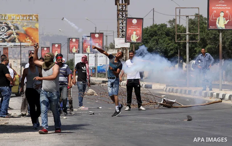 Palestinian activists from the Popular Front of the Liberation of Palestine (PFLP) demonstrate at the Hawara checkpoint near the West Bank city of Nablus on July 29, 2016, against the detention of Bilal Kayed, a fellow P...