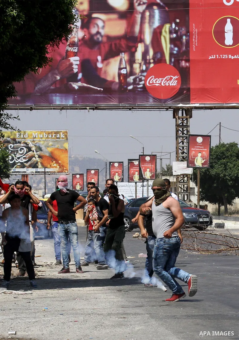 Palestinian activists from the Popular Front of the Liberation of Palestine (PFLP) demonstrate at the Hawara checkpoint near the West Bank city of Nablus on July 29, 2016, against the detention of Bilal Kayed, a fellow P...