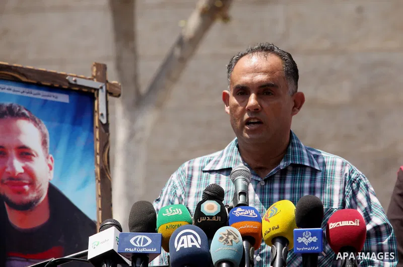 Palestinian Journalists hold banners during a protest calling for stop the Israeli violence against journalists in front of the high commissioner for human rights headquarters in Gaza City, on July 31, 2016. Photo by Ash...