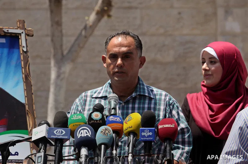 Palestinian Journalists hold banners during a protest calling for stop the Israeli violence against journalists in front of the high commissioner for human rights headquarters in Gaza City, on July 31, 2016. Photo by Ash...