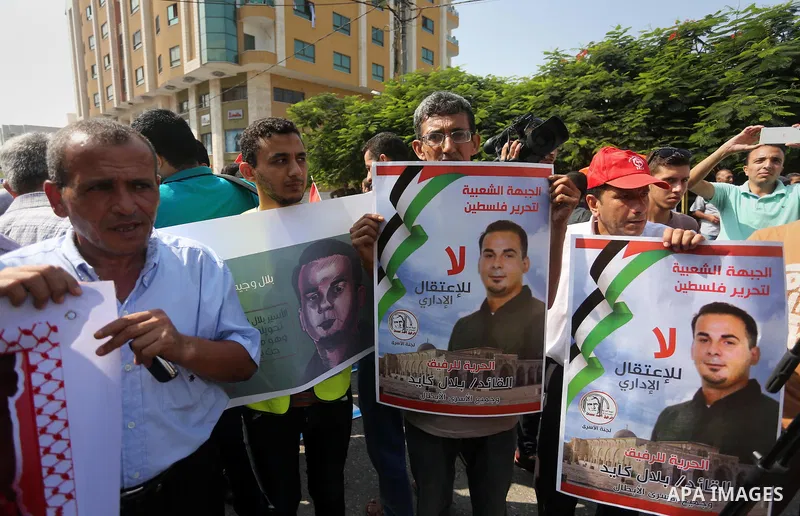 Supporters of the Popular Front for the Liberation of Palestine (PFLP) take part in a protest demanding for the release of Bilal Kayed a Palestinian prisoner on hunger strike,, in front of Red cross office, in Gaza city...