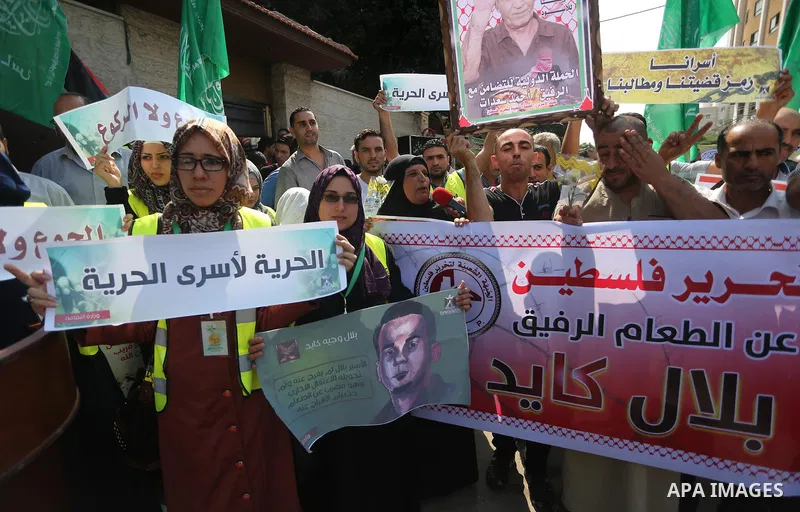 Supporters of the Popular Front for the Liberation of Palestine (PFLP) take part in a protest demanding for the release of Bilal Kayed a Palestinian prisoner on hunger strike,, in front of Red cross office, in Gaza city...