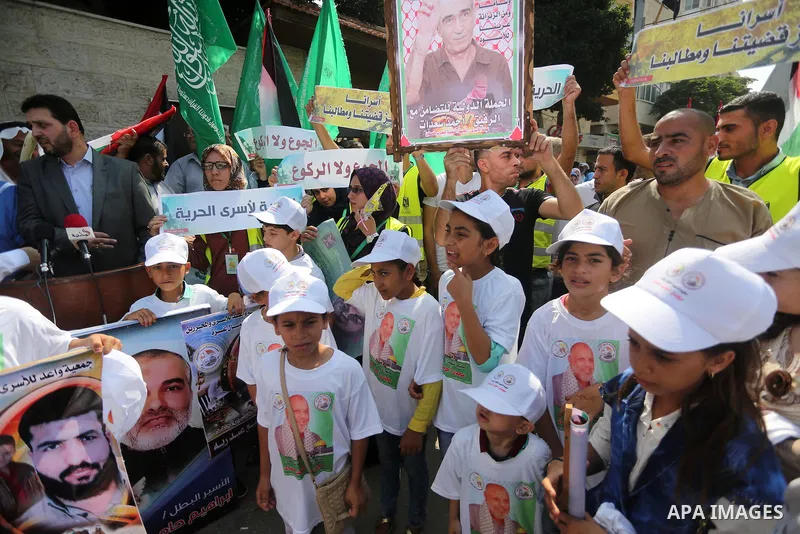 Palestinian children take part in a protest demanding for the release of Bilal Kayed a Palestinian prisoner on hunger strike,, in front of Red cross office, in Gaza city on Aug. 1, 2016. Photo by Mohammed Asad