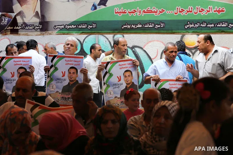 Supporters of the Popular Front for the Liberation of Palestine (PFLP) take part in a protest demanding for the release of Bilal Kayed a Palestinian prisoner on hunger strike,, in front of Red cross office, in Gaza city...