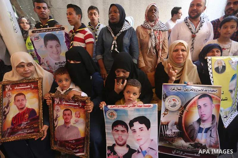 Palestinians take part in a protest demanding release the prisoners in Israeli jails, in front of Red cross office, in Gaza city on Aug. 1, 2016. Photo by Mohammed Asad