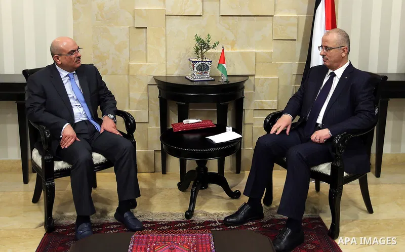 Palestinian Prime Minister, Rami Hamadallah, meets with President of the National Committee for the reconstruction of the Gaza Strip, Ambassador Mohammed Al Emadi, in the West Bank city of Ramallah, on Aug 1, 2016. Photo...