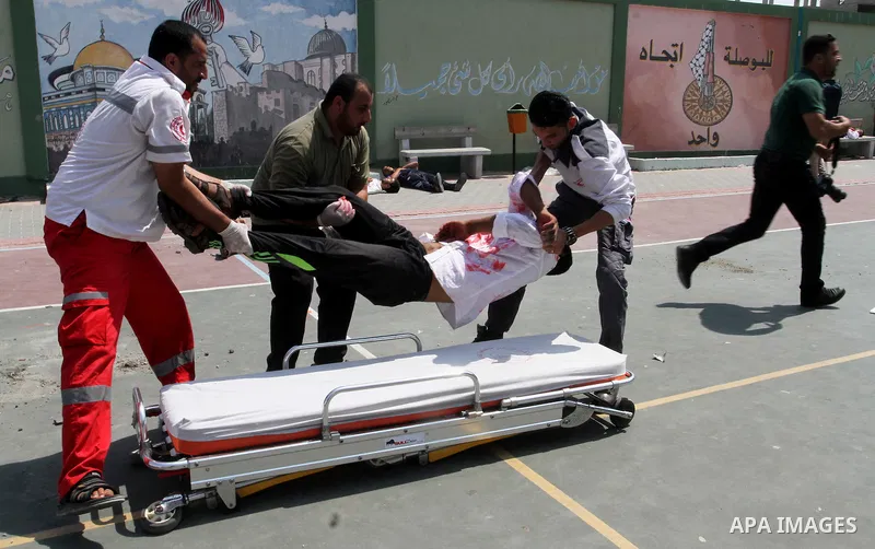 Palestinian rescue workers take part in an emergency simulation exercise in the border city of Rafah, in the southern Gaza Strip, on August 1, 2016. Photo by Abed Rahim Khatib