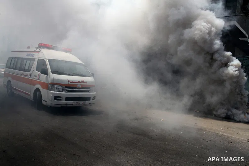 Palestinian rescue workers take part in an emergency simulation exercise in the border city of Rafah, in the southern Gaza Strip, on August 1, 2016. Photo by Abed Rahim Khatib
