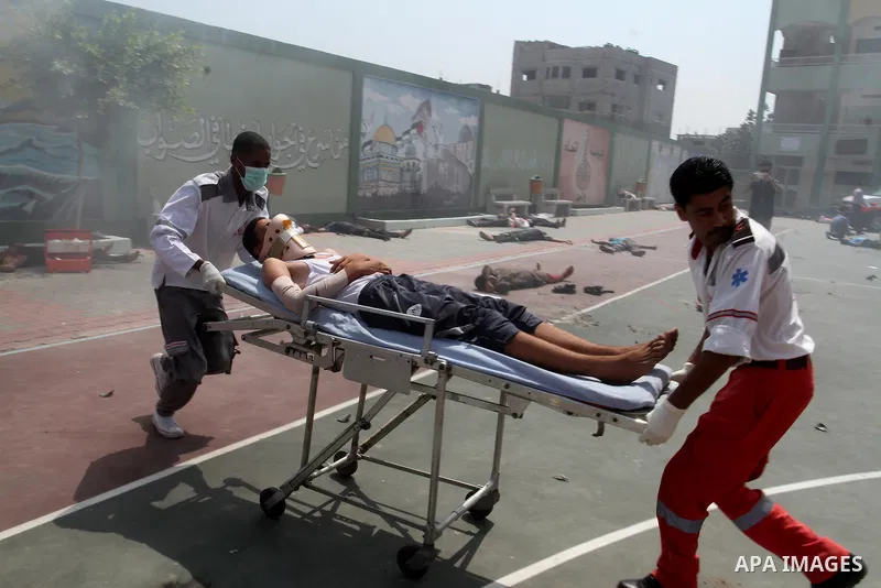 Palestinian rescue workers take part in an emergency simulation exercise in the border city of Rafah, in the southern Gaza Strip, on August 1, 2016. Photo by Abed Rahim Khatib