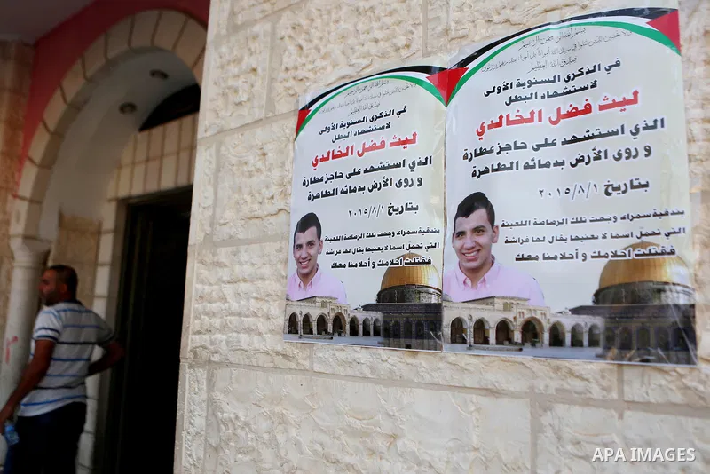 Palestinians attend a memorial service for Laith al-Khalidi who was killed by Israeli soldiers on August 1, 2015, during a demonstration after Jewish settlers attack Dawabsha family home, in Jalazoun refugee camp near th...