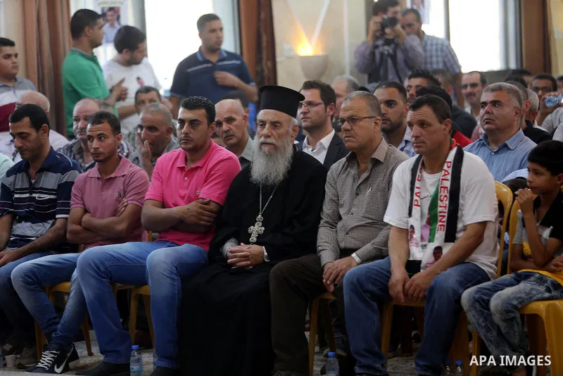 Palestinians attend a memorial service for Laith al-Khalidi who was killed by Israeli soldiers on August 1, 2015, during a demonstration after Jewish settlers attack Dawabsha family home, in Jalazoun refugee camp near th...