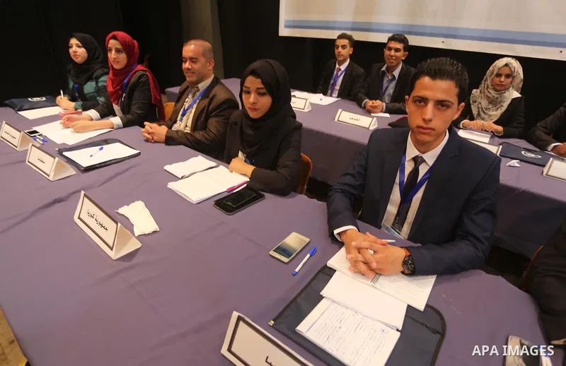 Palestinians take part in the first model of United Nations conference in Palestine, in Gaza city, on Aug. 2, 2016. Photo by Mohammed Asad