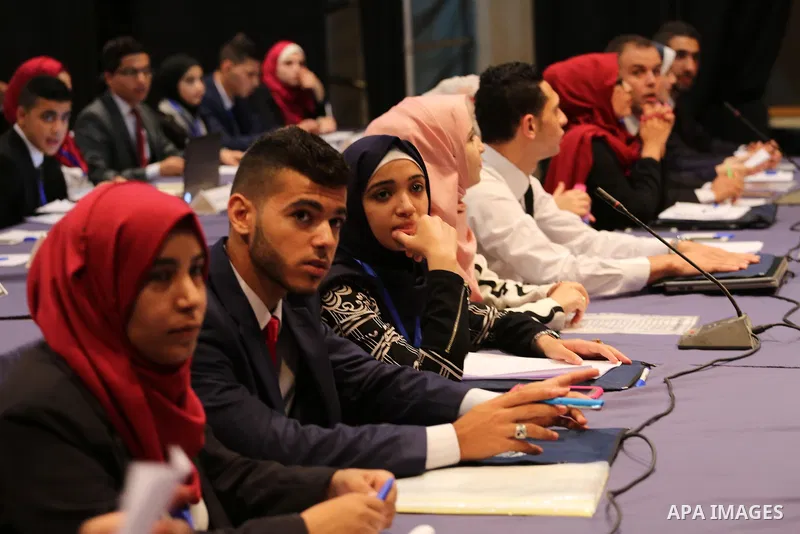Palestinians take part in the first model of United Nations conference in Palestine, in Gaza city, on Aug. 2, 2016. Photo by Mohammed Asad