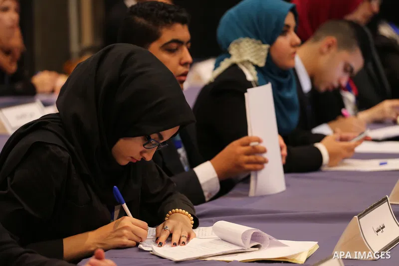 Palestinians take part in the first model of United Nations conference in Palestine, in Gaza city, on Aug. 2, 2016. Photo by Mohammed Asad