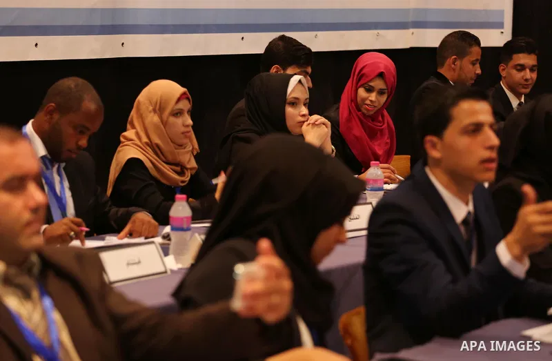 Palestinians take part in the first model of United Nations conference in Palestine, in Gaza city, on Aug. 2, 2016. Photo by Mohammed Asad