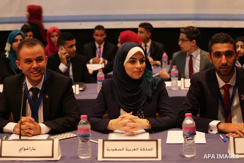 Palestinians take part in the first model of United Nations conference in Palestine, in Gaza city, on Aug. 2, 2016. Photo by Mohammed Asad