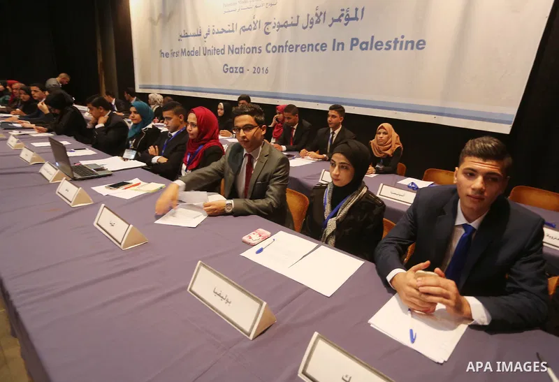Palestinians take part in the first model of United Nations conference in Palestine, in Gaza city, on Aug. 2, 2016. Photo by Mohammed Asad