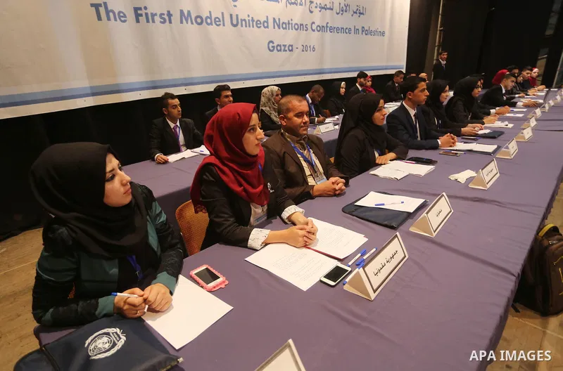 Palestinians take part in the first model of United Nations conference in Palestine, in Gaza city, on Aug. 2, 2016. Photo by Mohammed Asad