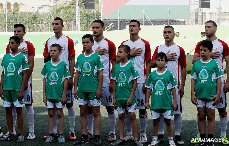 Palestinian players of Gaza's Shabab Khan Yunis pose for a picture before a second leg match for the Palestinian Cup final on August 2, 2016 at Hussein Bin Ali Stadium in the West Bank city of Hebron. The match had origi...