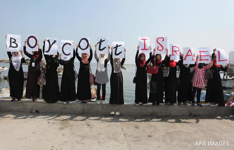 Palestinian girls hold banners during a protest to mark the second anniversary of the 50-day Israeli war on Gaza Strip last summer, in Gaza seaport Aug. 03, 2016. July 8th marks the two-year anniversary of the war betwee...