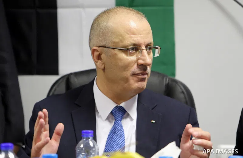 Palestinian Prime Minister Rami Hamdallah attends the opening ceremony of the new wing operations of Alia governmental hospital, in the West Bank city of Hebron, on Aug. 03, 2016. Photo by Prime Minister Office