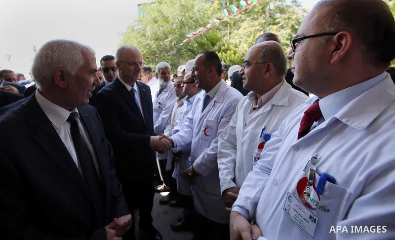 Palestinian Prime Minister Rami Hamdallah attends the opening ceremony of the new wing operations of Alia governmental hospital, in the West Bank city of Hebron, on Aug. 03, 2016. Photo by Prime Minister Office