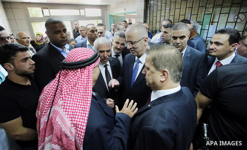 Palestinian Prime Minister Rami Hamdallah attends the opening ceremony of the new wing operations of Alia governmental hospital, in the West Bank city of Hebron, on Aug. 03, 2016. Photo by Prime Minister Office