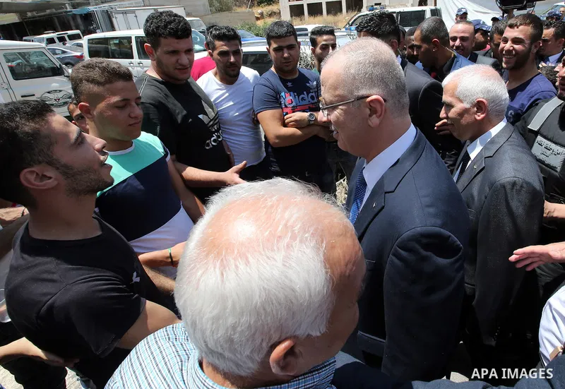 Palestinian Prime Minister Rami Hamdallah attends the opening ceremony of the new wing operations of Alia governmental hospital, in the West Bank city of Hebron, on Aug. 03, 2016. Photo by Prime Minister Office