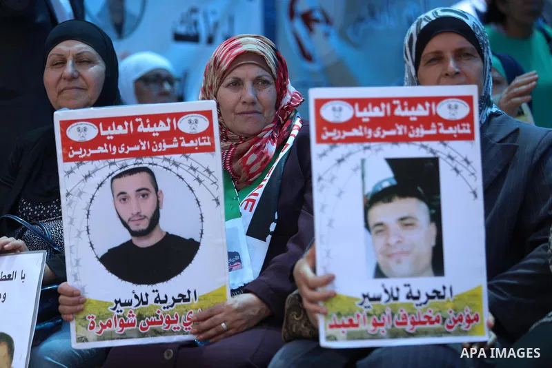 Palestinians take part in a protest demanding for the release of Bilal Kayed a Palestinian prisoner on hunger strike, in the West Bank city Ramallah on Aug. 03, 2016. Kayed who was due to be released after serving a 14-a...