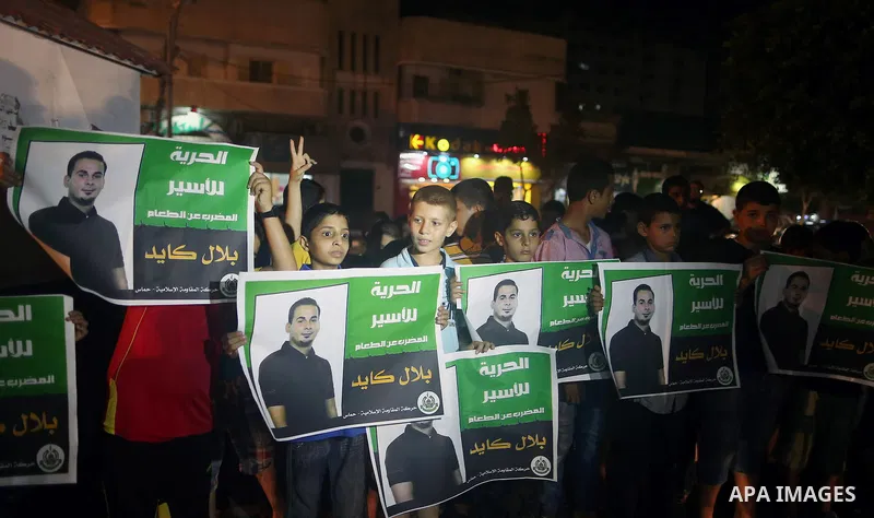 Palestinian children take part in a protest demanding for the release of Bilal Kayed a Palestinian prisoner on hunger strike, in Gaza city, on Aug. 03, 2016. Kayed who was due to be released after serving a 14-and-a-half...