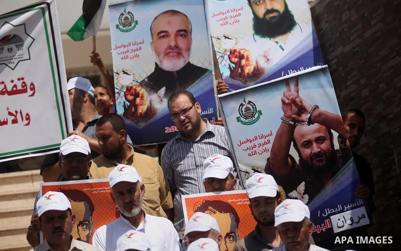 Members of Hamas legislative council take part during a protest demanding for the release of Palestinian prisoners on hunger strike in Israeli jails, in Gaza city, on Aug. 04, 2016. Photo by Ashraf Amra