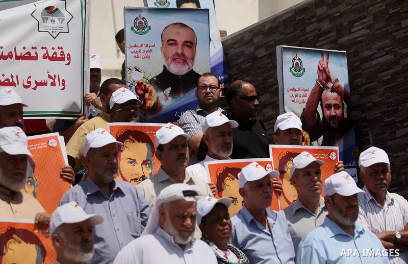 Members of Hamas legislative council take part during a protest demanding for the release of Palestinian prisoners on hunger strike in Israeli jails, in Gaza city, on Aug. 04, 2016. Photo by Ashraf Amra