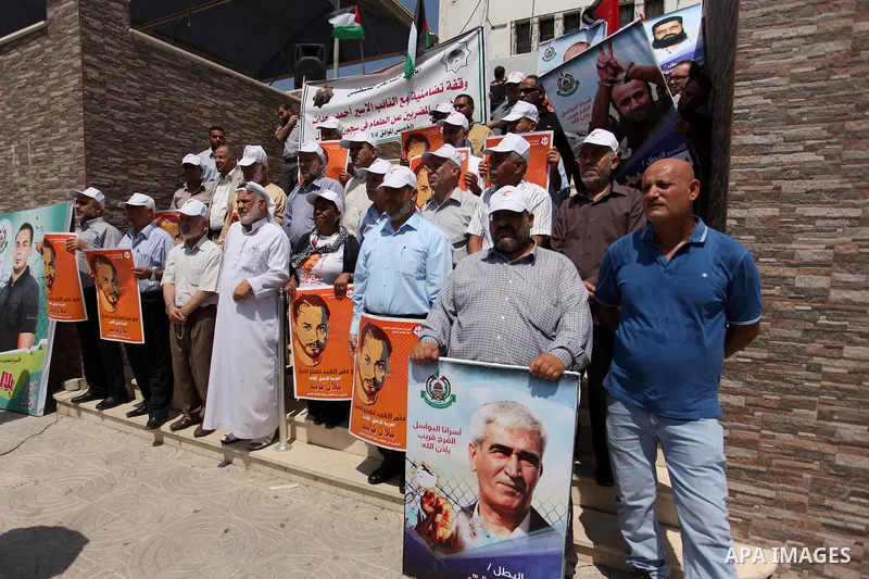 Members of Hamas legislative council take part during a protest demanding for the release of Palestinian prisoners on hunger strike in Israeli jails, in Gaza city, on Aug. 04, 2016. Photo by Ashraf Amra