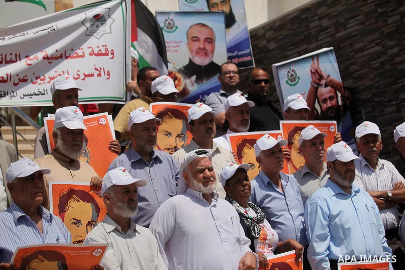 Members of Hamas legislative council take part during a protest demanding for the release of Palestinian prisoners on hunger strike in Israeli jails, in Gaza city, on Aug. 04, 2016. Photo by Ashraf Amra