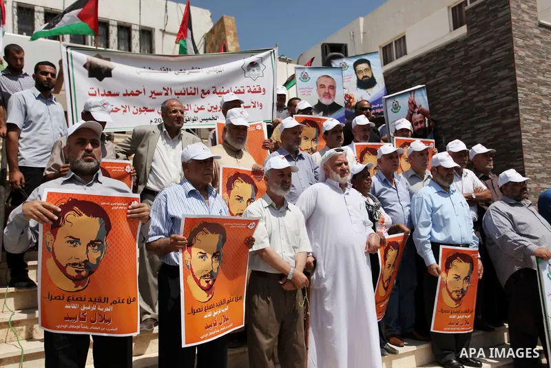 Members of Hamas legislative council take part during a protest demanding for the release of Palestinian prisoners on hunger strike in Israeli jails, in Gaza city, on Aug. 04, 2016. Photo by Ashraf Amra