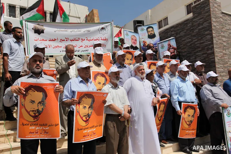 Members of Hamas legislative council take part during a protest demanding for the release of Palestinian prisoners on hunger strike in Israeli jails, in Gaza city, on Aug. 04, 2016. Photo by Ashraf Amra