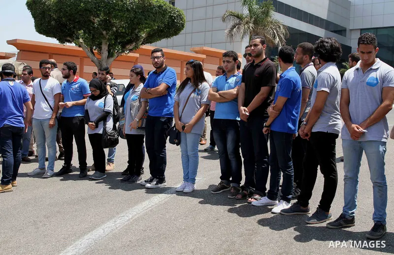 Egyptian mourners surround an ambulance transporting the body of nobel prize-winning Egyptian-American chemist Ahmed Zewail, leaves Cairo airport after his corpse arrived in Egypt on August 6, 2016 for his funeral. Zewai...