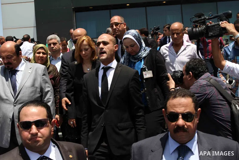 Dema Faham (C), the wife of nobel prize-winning Egyptian-American chemist Ahmed Zewail, arrives at Cairo airport to receive her husband's body after it arrived in Egypt on August 6, 2016 for his funeral. Zewail, who serv...