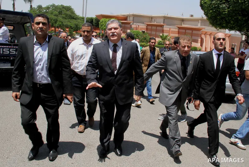 Egyptian mourners surround an ambulance transporting the body of nobel prize-winning Egyptian-American chemist Ahmed Zewail, leaves Cairo airport after his corpse arrived in Egypt on August 6, 2016 for his funeral. Zewai...