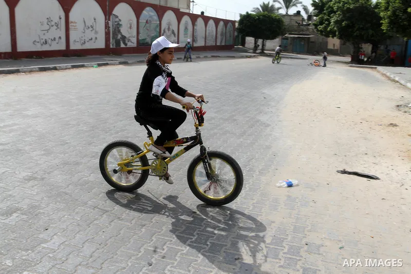 Palestinian children take part in the bicycles marathon to demand their right to play and break the siege on Gaza strip, in Rafah in the southern Gaza Strip. on August 7, 2016. Photo by Abed Rahim Khatib