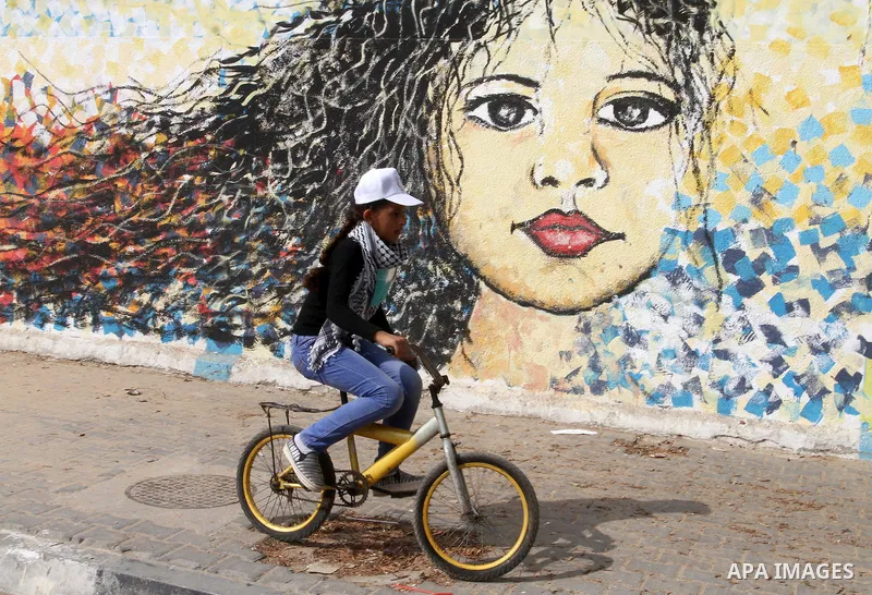 Palestinian children take part in the bicycles marathon to demand their right to play and break the siege on Gaza strip, in Rafah in the southern Gaza Strip. on August 7, 2016. Photo by Abed Rahim Khatib