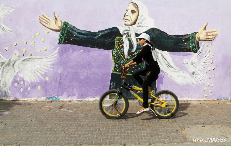 Palestinian children take part in the bicycles marathon to demand their right to play and break the siege on Gaza strip, in Rafah in the southern Gaza Strip. on August 7, 2016. Photo by Abed Rahim Khatib
