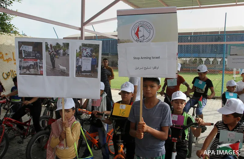 Palestinian children take part in the bicycles marathon to demand their right to play and break the siege on Gaza strip, in Rafah in the southern Gaza Strip. on August 7, 2016. Photo by Abed Rahim Khatib