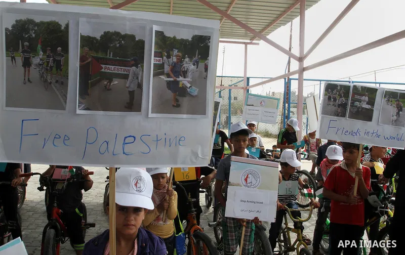 Palestinian children take part in the bicycles marathon to demand their right to play and break the siege on Gaza strip, in Rafah in the southern Gaza Strip. on August 7, 2016. Photo by Abed Rahim Khatib