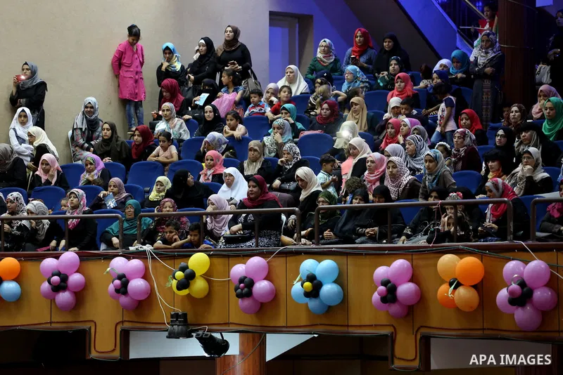 Palestinian deaf students participate in their first graduation ceremony at the Islamic University in Gaza city on August 7, 2016. Photo by Mohammed Asad